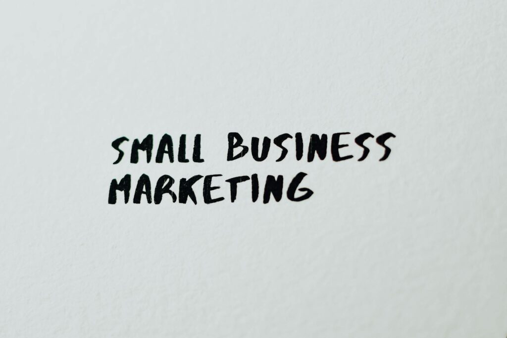 Text 'Small Business Marketing' written on white paper for creative use.
